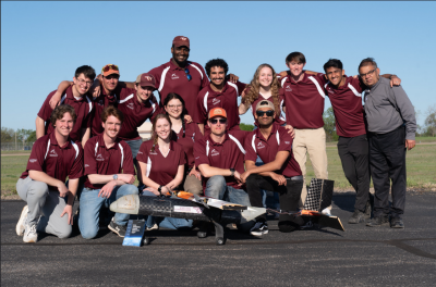 The 2024 Virginia Tech Design, 构建, Fly team with their aircraft, Hokie Express, at the annual AIAA competition. 